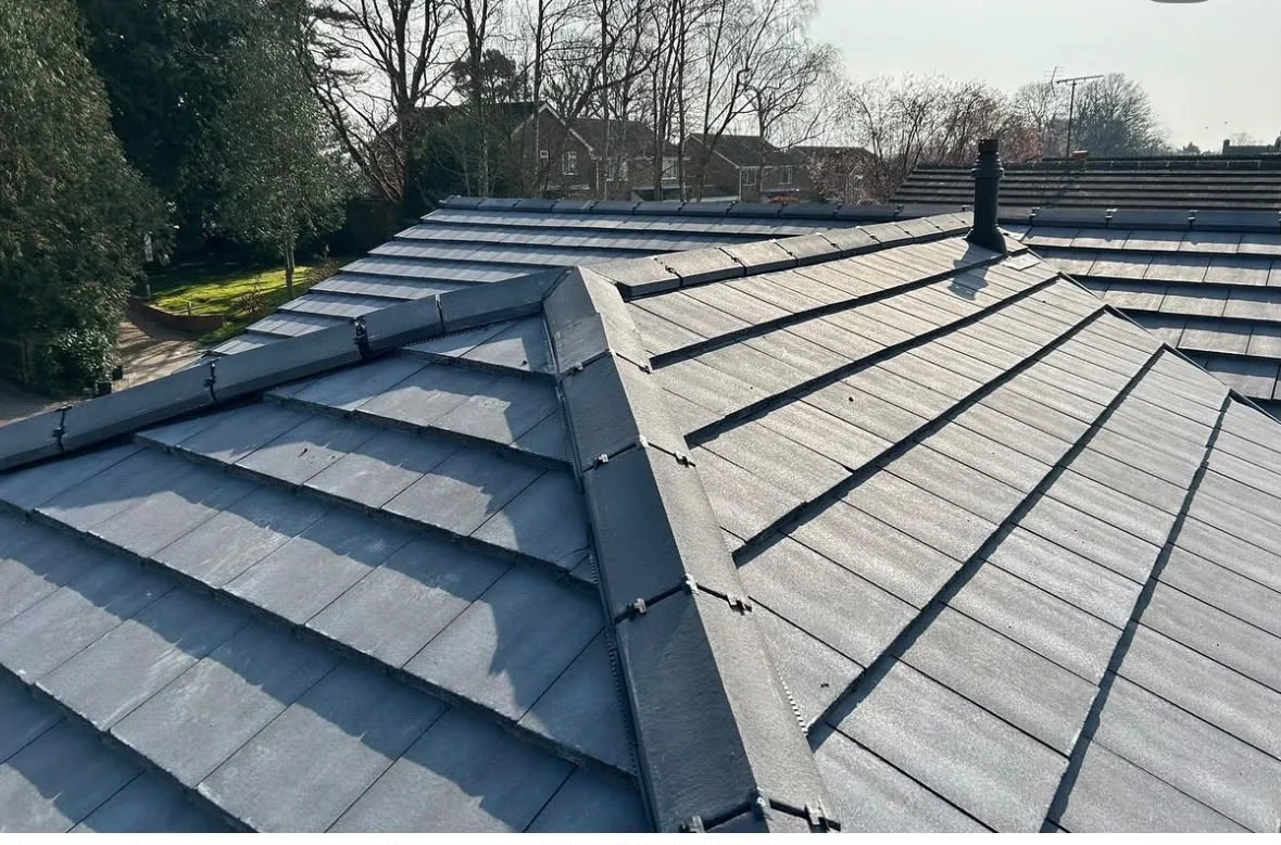 Completed grey tiled roof with ridge detailing