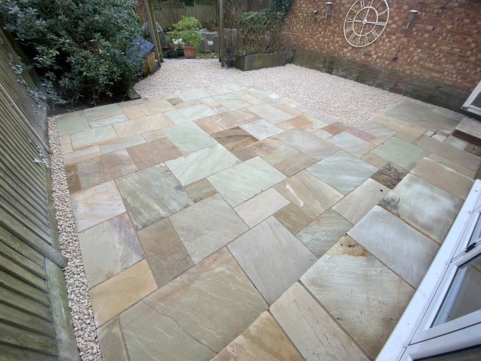 Finished patio laid with multicoloured stone paving